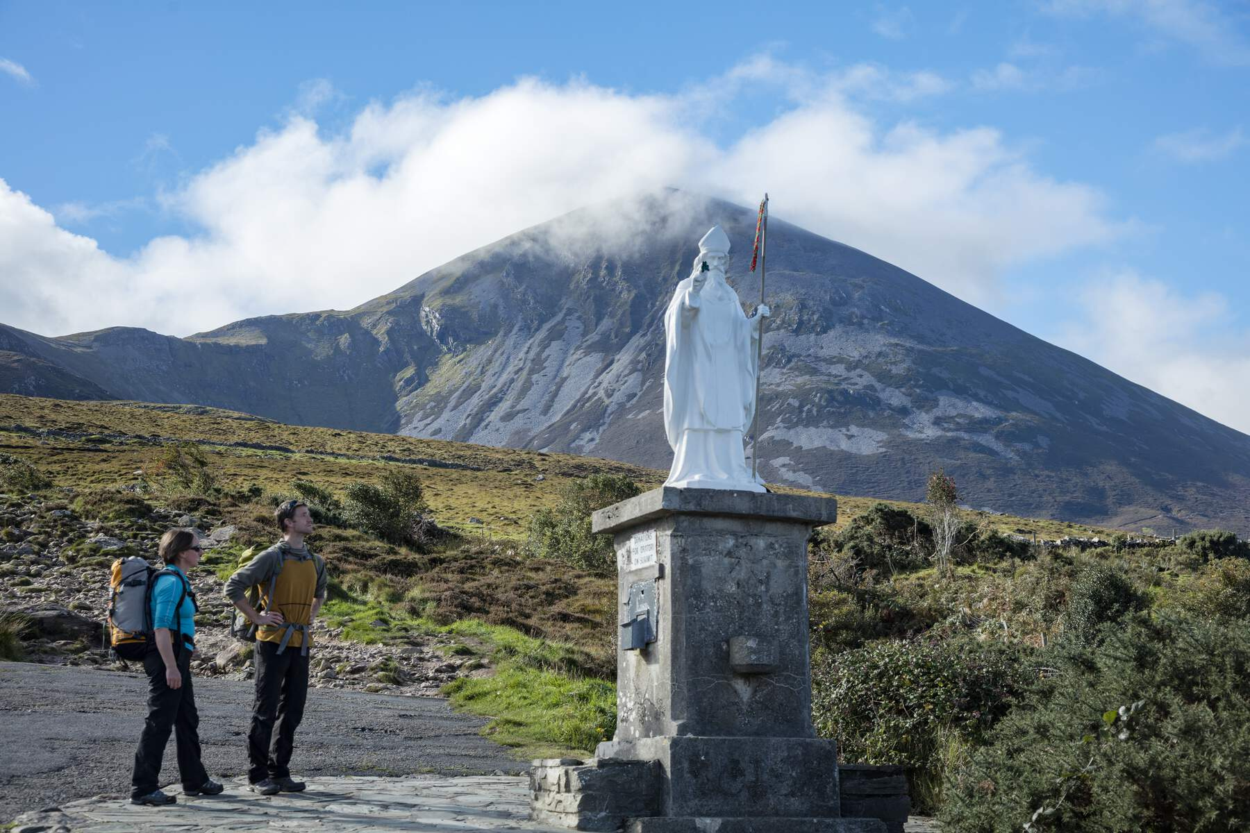 walkers pausing at statue of st patrick at foot of croagh patrick co mayo web size